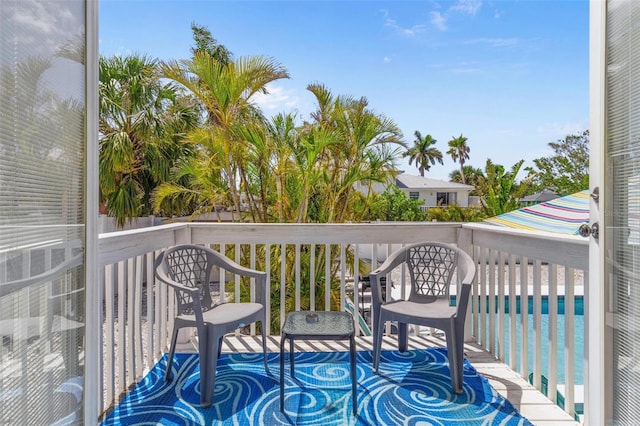deck featuring a community pool