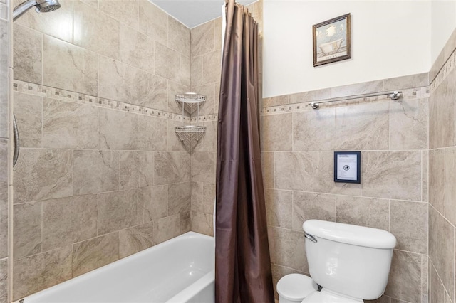 full bath featuring tile walls, shower / tub combo, and toilet