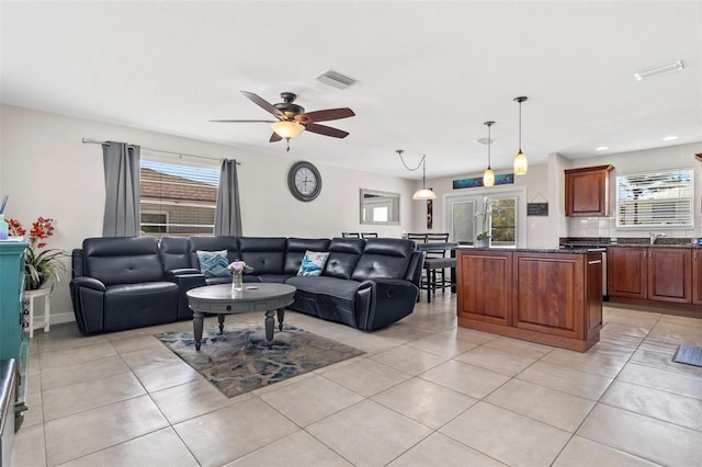 living area featuring a ceiling fan, light tile patterned flooring, visible vents, and recessed lighting