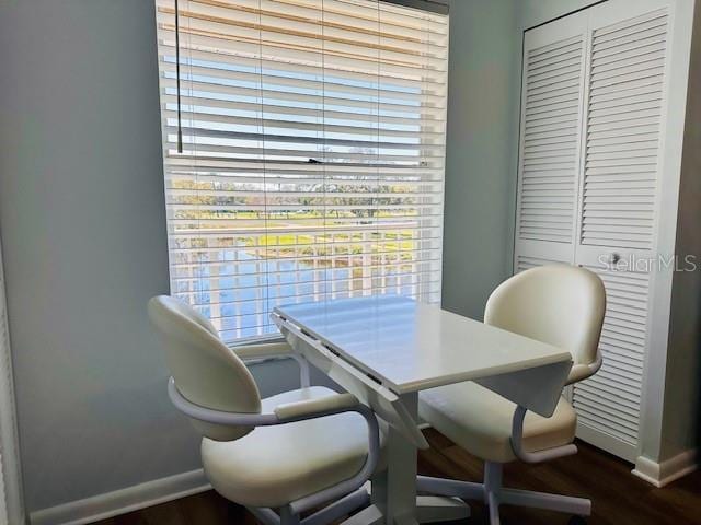 office featuring baseboards and dark wood-style flooring