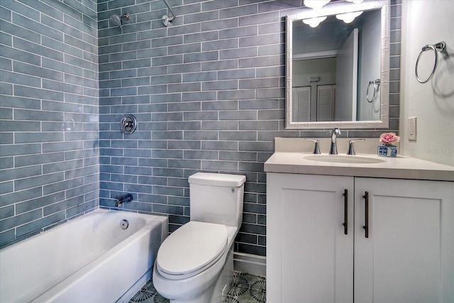 bathroom featuring toilet, shower / bath combination, tile walls, and vanity