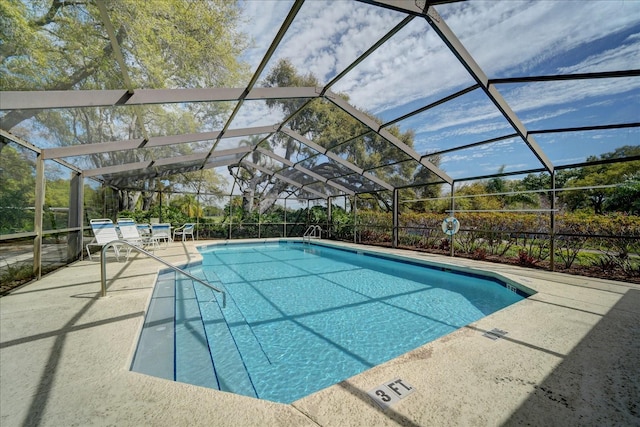 pool featuring a lanai and a patio area