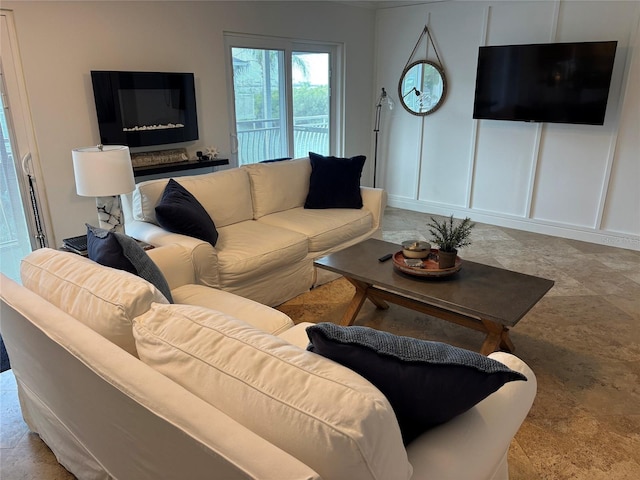 living area with a decorative wall