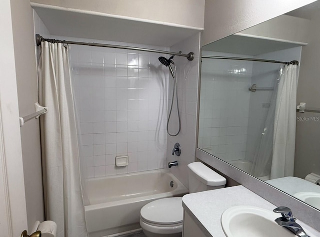 bathroom featuring shower / tub combo with curtain, vanity, and toilet