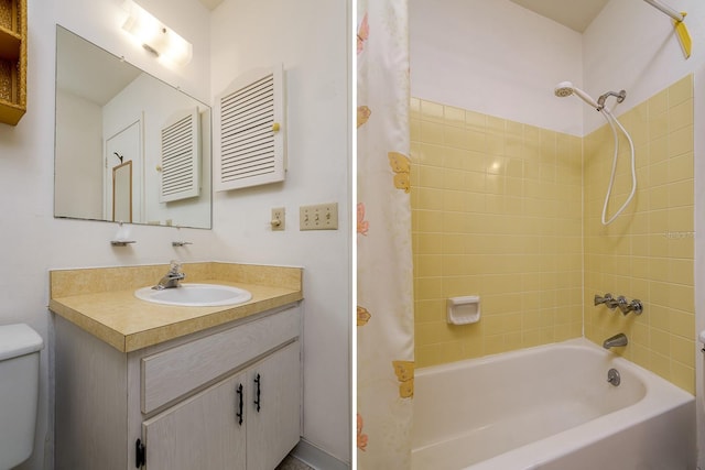 bathroom with shower / bath combo, vanity, and toilet