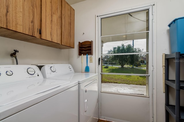 laundry room with cabinet space and washing machine and dryer