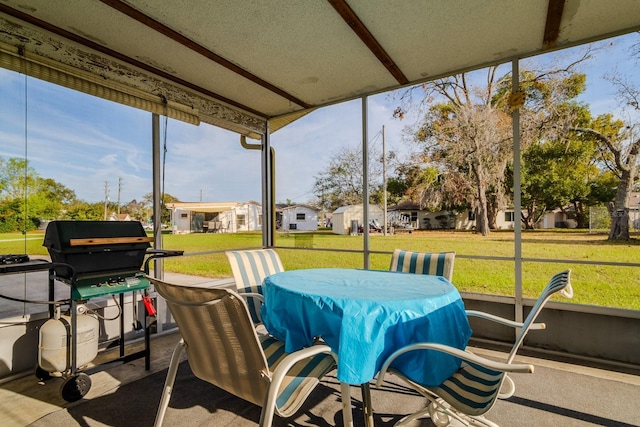 sunroom featuring a residential view