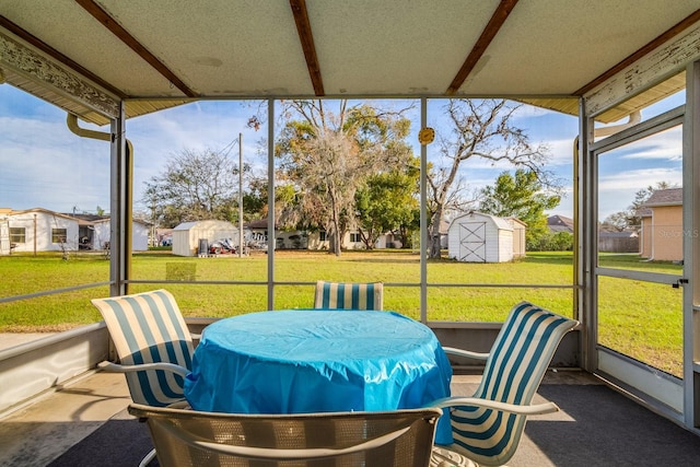 sunroom featuring a residential view