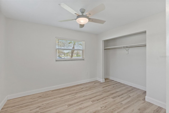 unfurnished bedroom featuring a closet, ceiling fan, baseboards, and wood finished floors