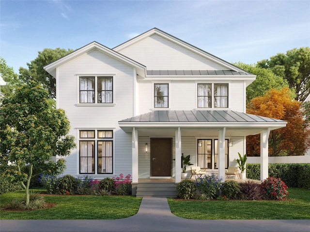modern inspired farmhouse with a standing seam roof, metal roof, a porch, and a front yard