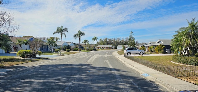 view of street featuring sidewalks, a residential view, and curbs