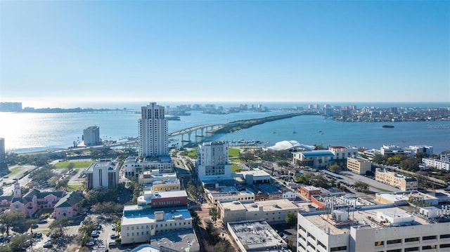 birds eye view of property featuring a water view and a city view