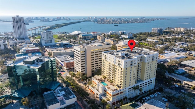 drone / aerial view featuring a water view and a city view