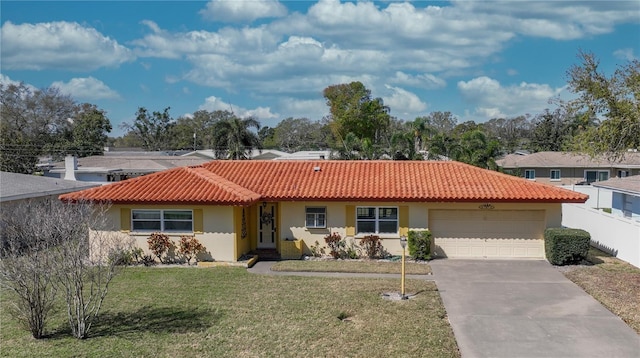 single story home with stucco siding, a front yard, a garage, driveway, and a tiled roof