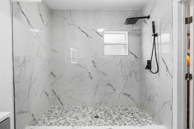 full bathroom with a marble finish shower