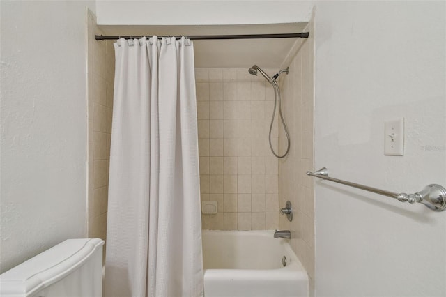 full bath with shower / tub combo and toilet