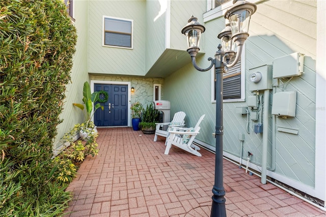 entrance to property with a patio area