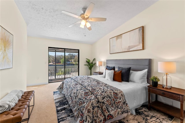 carpeted bedroom featuring a textured ceiling, ceiling fan, baseboards, and access to exterior