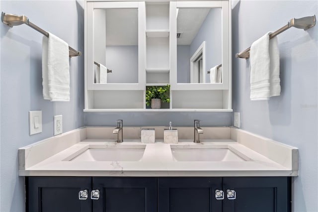 bathroom with double vanity and a sink