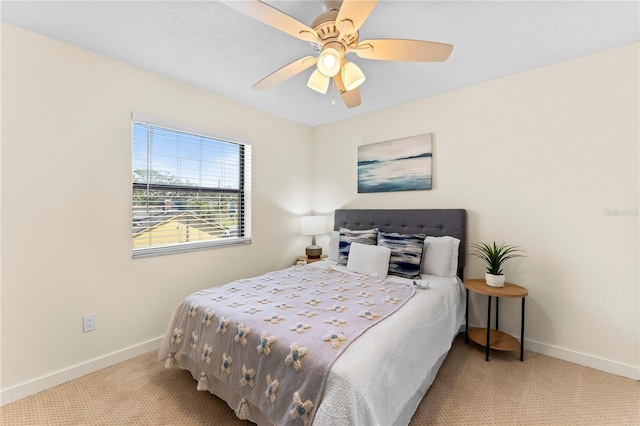 bedroom featuring carpet floors, ceiling fan, and baseboards