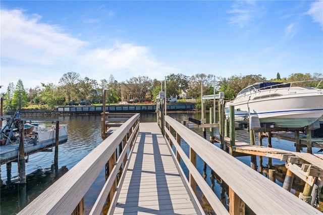 view of dock with a water view and boat lift