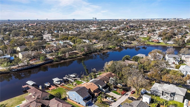 birds eye view of property with a water view and a residential view