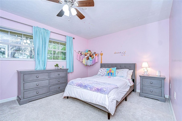 bedroom featuring ceiling fan, carpet floors, and baseboards