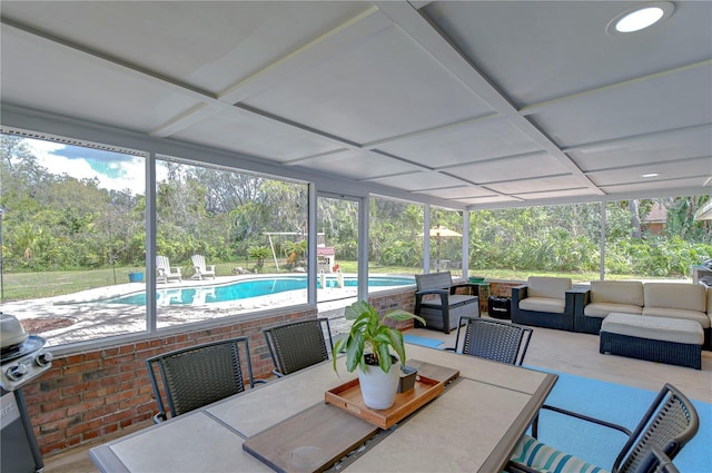 sunroom featuring coffered ceiling