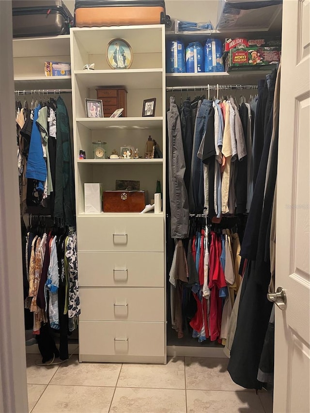 spacious closet featuring tile patterned flooring