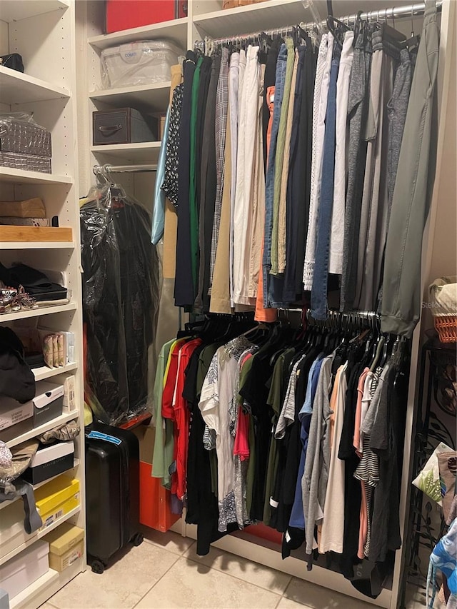 spacious closet featuring tile patterned flooring