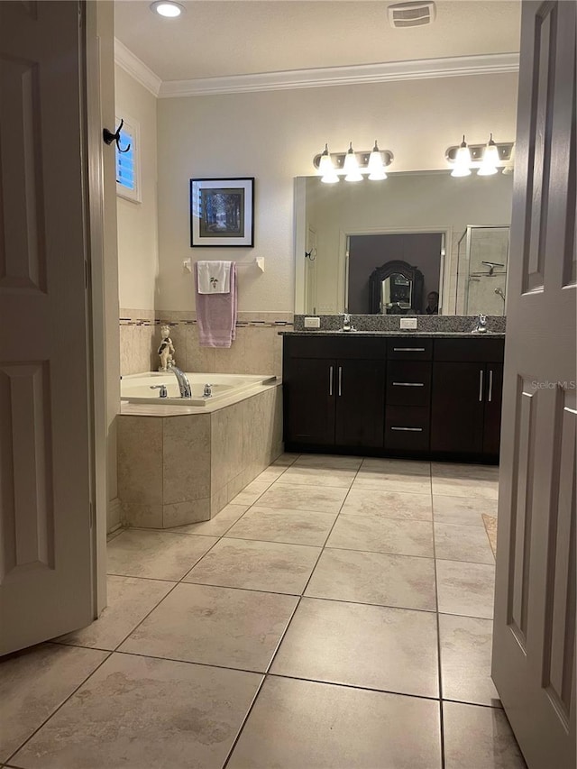 bathroom featuring a garden tub, tile patterned floors, double vanity, a stall shower, and crown molding