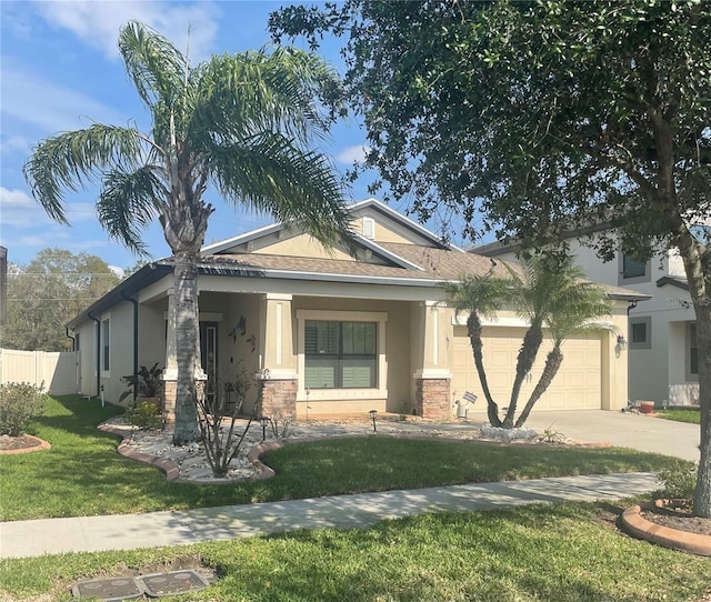 view of front facade featuring concrete driveway, an attached garage, fence, a front lawn, and stucco siding