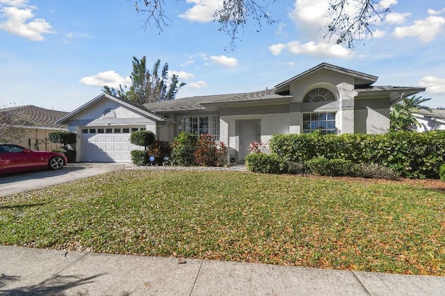 ranch-style home featuring a front yard, driveway, an attached garage, and stucco siding