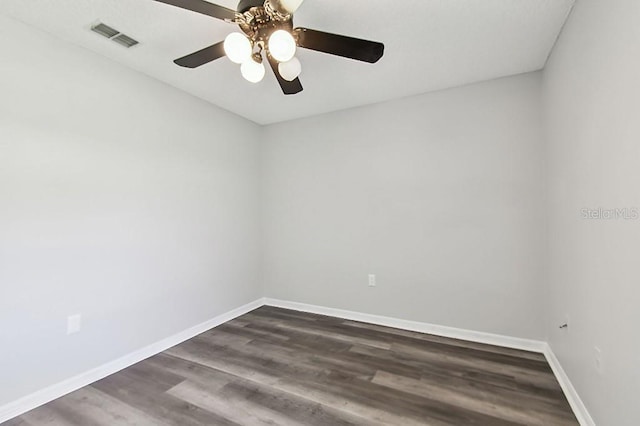 915 Brittany Park Blvd, Tarpon Springs, FL 34689 - unfurnished room featuring baseboards, dark wood-type flooring, and ceiling fan