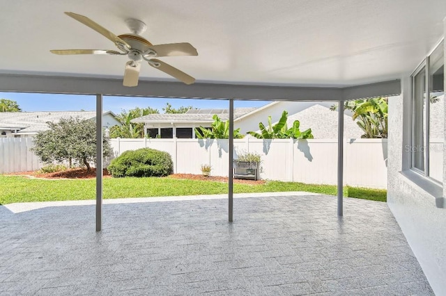 915 Brittany Park Blvd, Tarpon Springs, FL 34689 - unfurnished sunroom featuring a ceiling fan