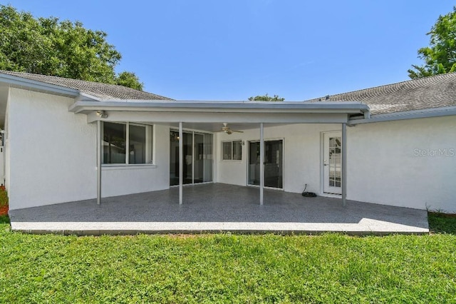 915 Brittany Park Blvd, Tarpon Springs, FL 34689 - back of house featuring a patio, ceiling fan, and stucco siding