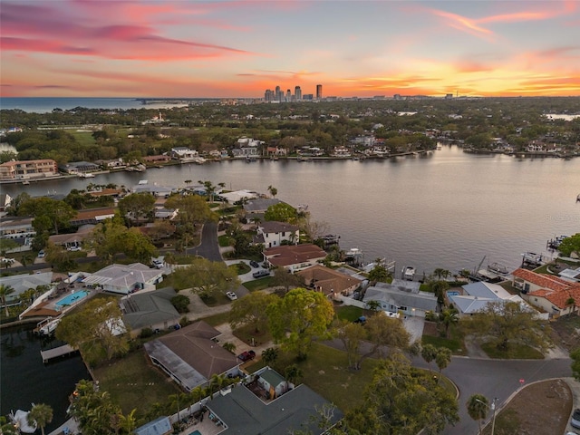 aerial view at dusk with a water view