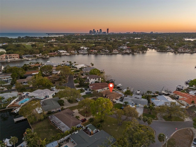 aerial view at dusk with a water view