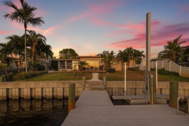 dock area with a lawn