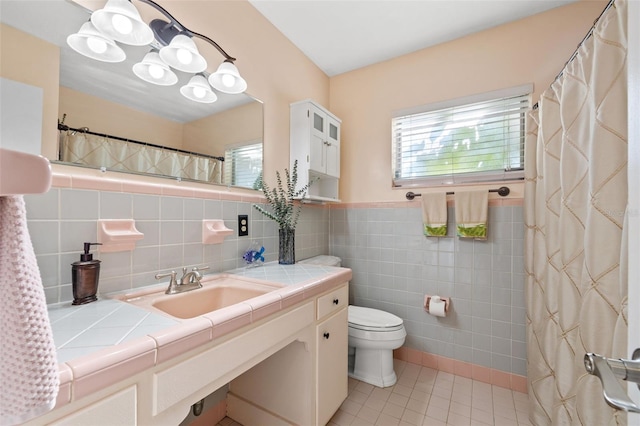 full bathroom featuring curtained shower, tile walls, toilet, tile patterned floors, and vanity