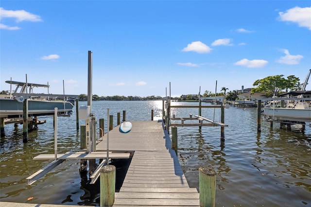 dock area featuring a water view and boat lift