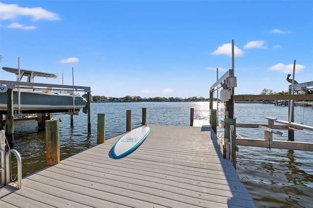 dock area featuring a water view and boat lift