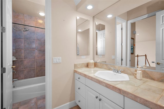 full bath with recessed lighting, bathtub / shower combination, vanity, and baseboards