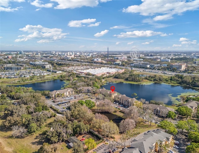 birds eye view of property with a water view and a city view