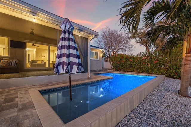 pool with a patio area and ceiling fan