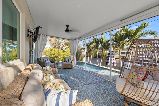 sunroom with a ceiling fan