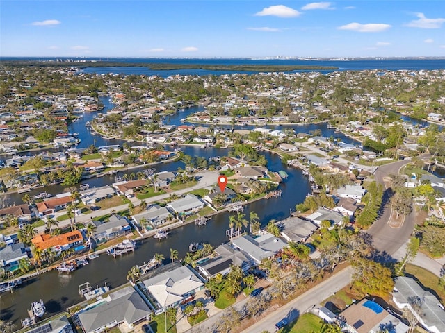 birds eye view of property featuring a residential view and a water view