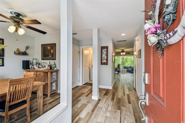 foyer with visible vents, recessed lighting, light wood-style flooring, and baseboards