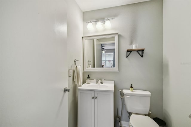 bathroom with toilet and vanity