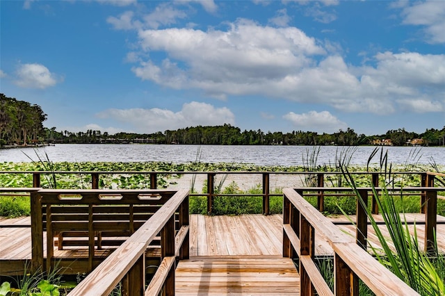 dock area featuring a deck with water view